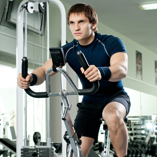 Man exercising on a machine in a gym